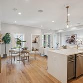 a kitchen with a table and chairs
