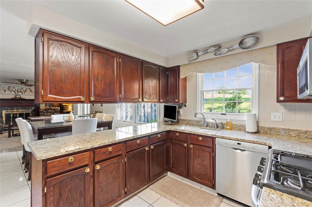 99 Walnut Drive McKees Rocks, PA 15136 - Photo 15 of 50 a kitchen with a sink stove top oven and cabinets