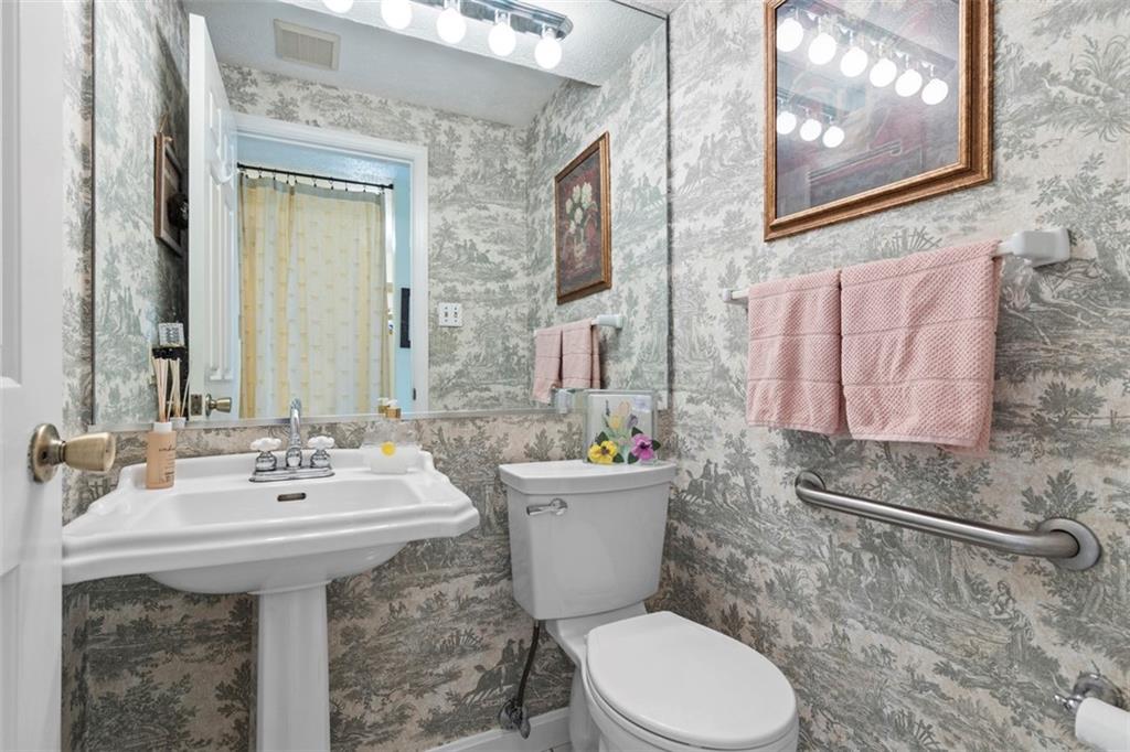 99 Walnut Drive McKees Rocks, PA 15136 - Photo 19 of 50 a bathroom with a sink and mirror with toilet