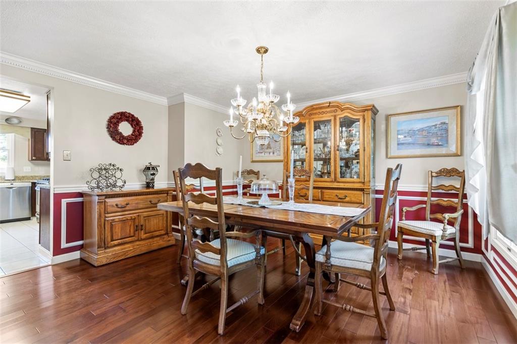 99 Walnut Drive McKees Rocks, PA 15136 - Photo 20 of 50 a dining room with a wooden table and chairs