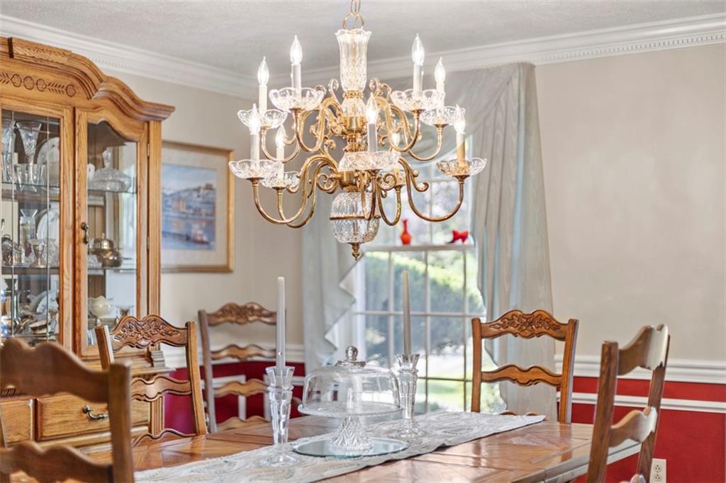 99 Walnut Drive McKees Rocks, PA 15136 - Photo 22 of 50 a view of a dining room with furniture water and chandelier