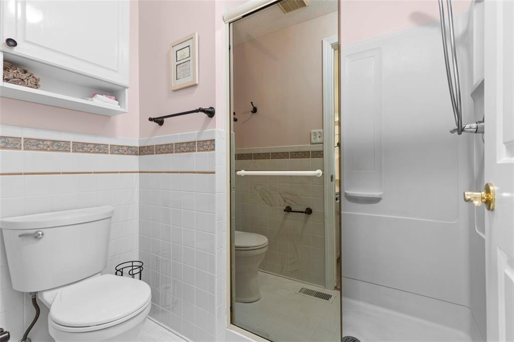 99 Walnut Drive McKees Rocks, PA 15136 - Photo 27 of 50 a white toilet sitting next to a bathroom sink