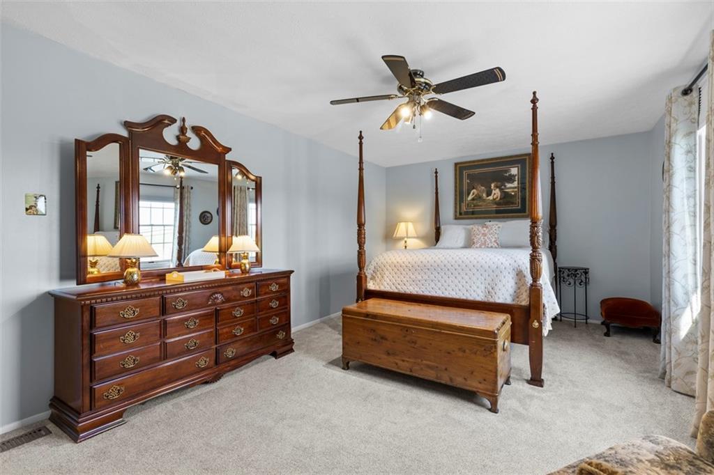 99 Walnut Drive McKees Rocks, PA 15136 - Photo 30 of 50 a bedroom with a bed and a chandelier