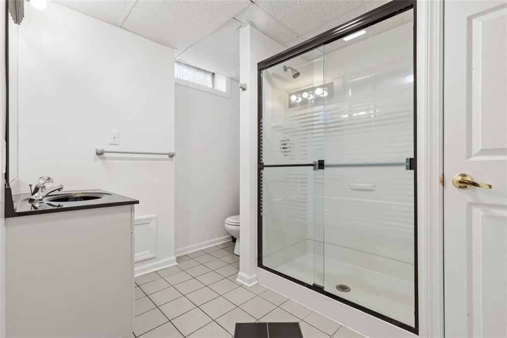 99 Walnut Drive McKees Rocks, PA 15136 - Photo 39 of 50 a bathroom with a granite countertop sink mirror and shower