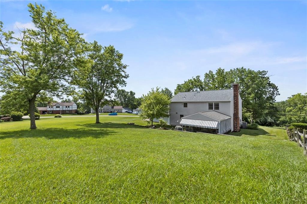 99 Walnut Drive McKees Rocks, PA 15136 - Photo 45 of 50 a view of a house with a big yard and large trees