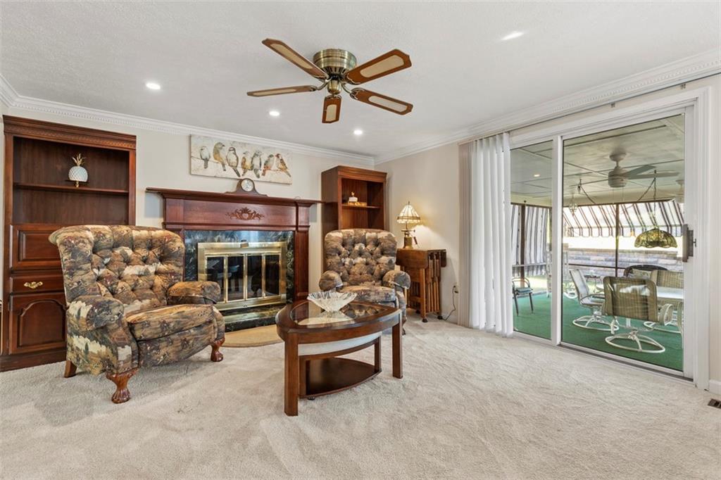 99 Walnut Drive McKees Rocks, PA 15136 - Photo 9 of 50 a living room with furniture and a large window with kitchen view