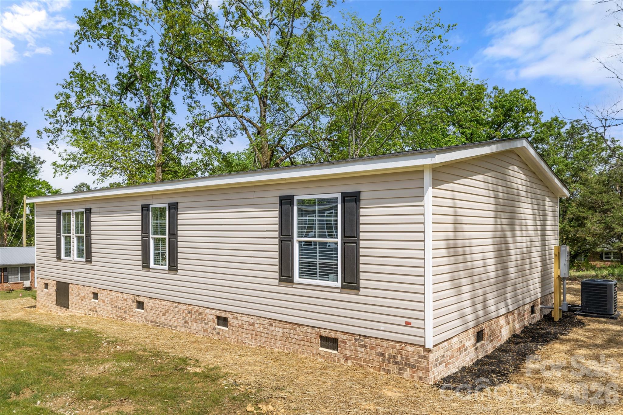 1109 Marion Street Lancaster, SC 29720 - Photo 26 of 44 a house with trees in the background