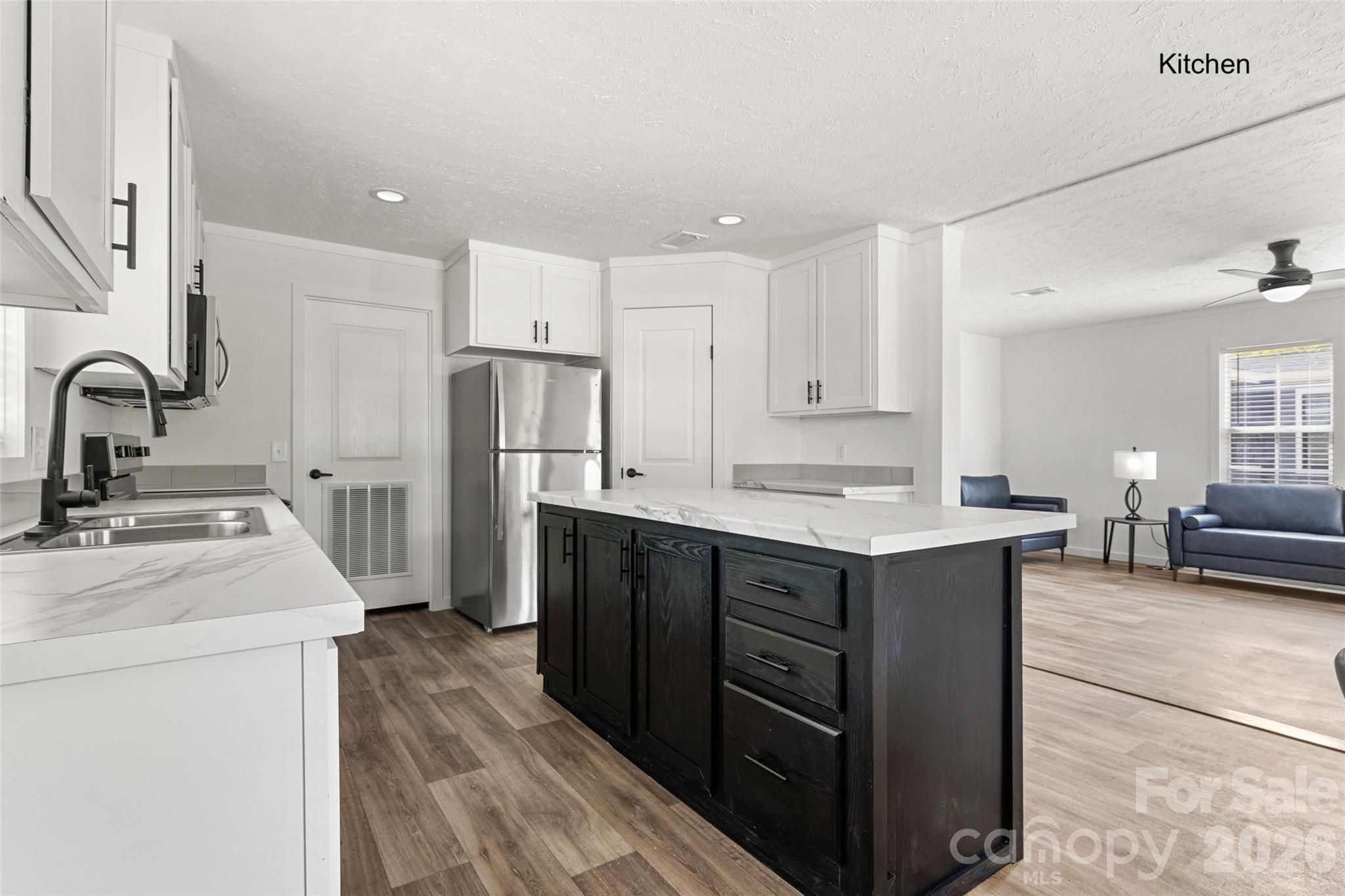 1109 Marion Street Lancaster, SC 29720 - Photo 6 of 44 a kitchen with a sink stove and refrigerator