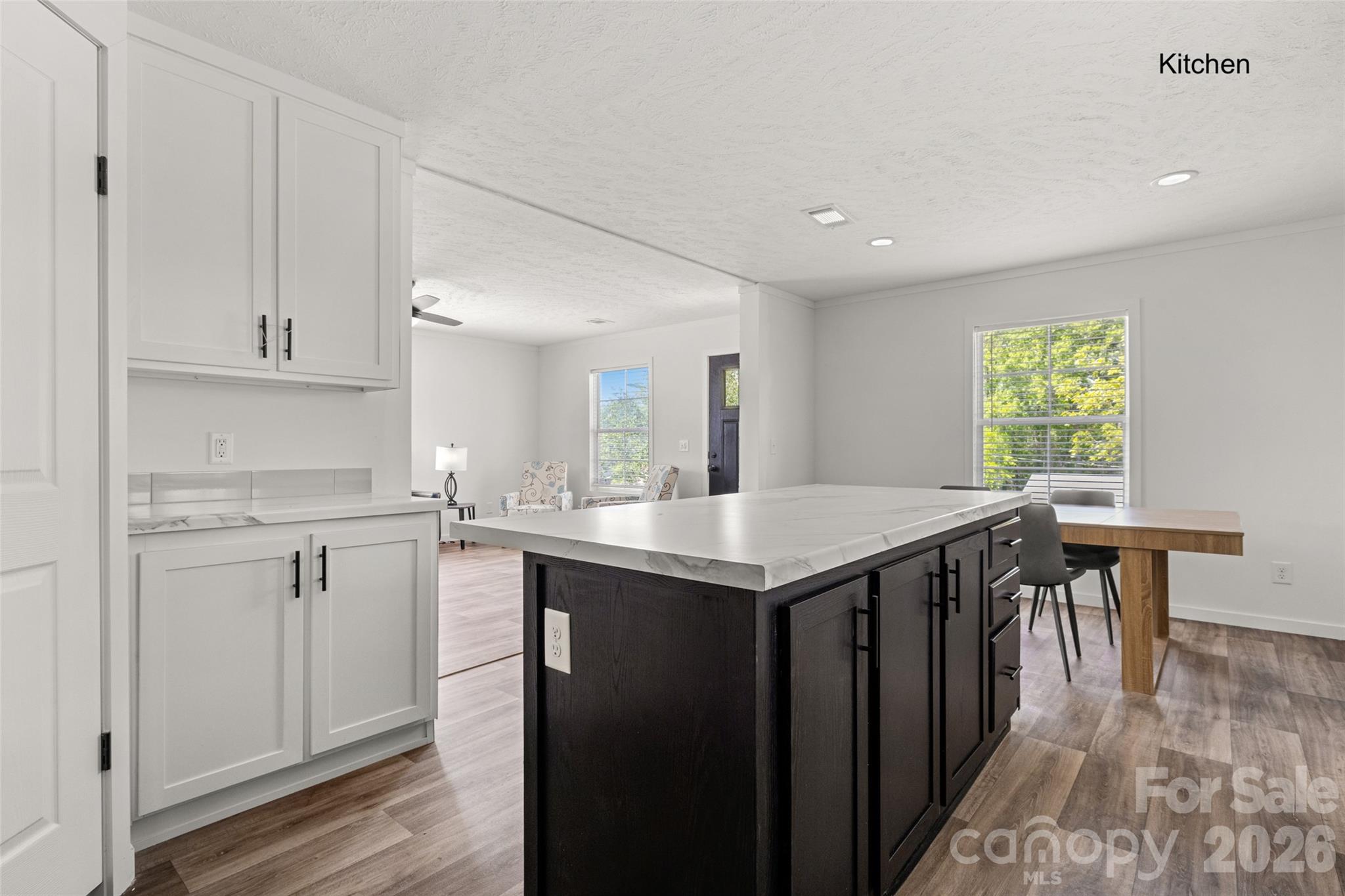 1109 Marion Street Lancaster, SC 29720 - Photo 7 of 44 a kitchen with a table chairs sink and cabinets