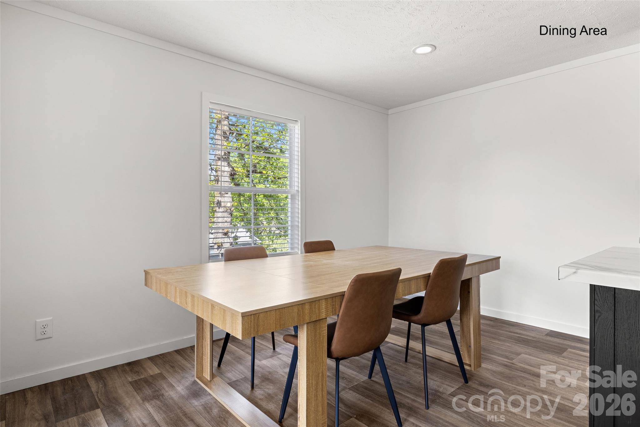 1109 Marion Street Lancaster, SC 29720 - Photo 8 of 44 a view of a dining room with furniture and wooden floor