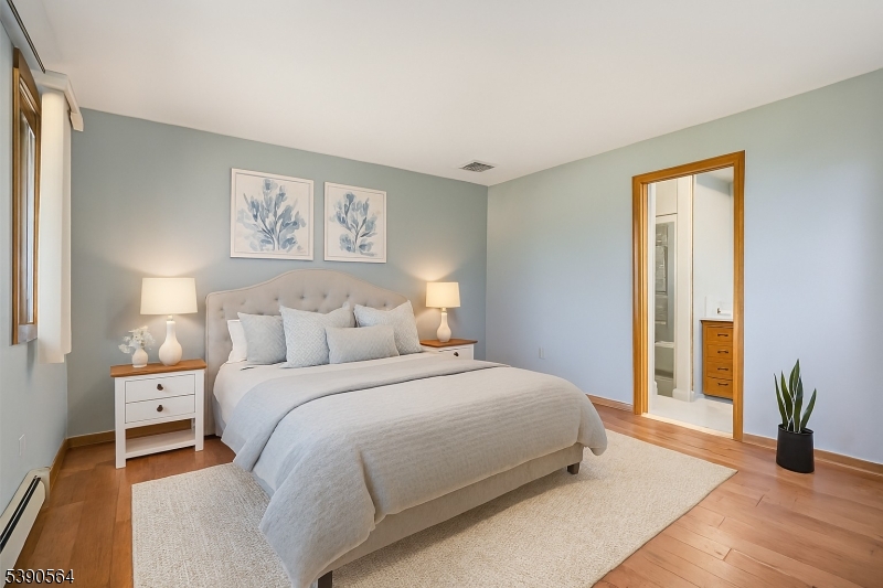 8 Cambridge Road Totowa, NJ 07512 - Photo 14 of 35 a bedroom with a bed and a large window