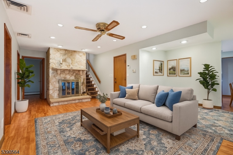 8 Cambridge Road Totowa, NJ 07512 - Photo 20 of 35 a living room with furniture and a large window