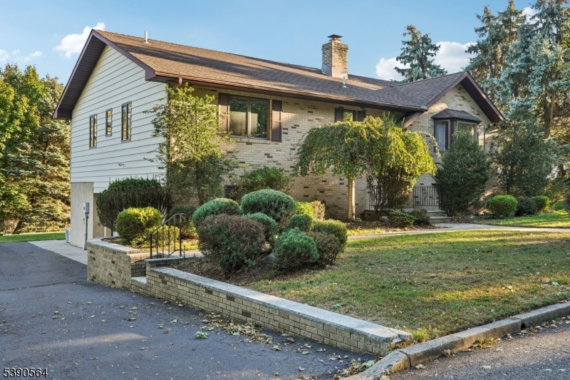 8 Cambridge Road Totowa, NJ 07512 - Photo 2 of 35 a front view of a house with garden