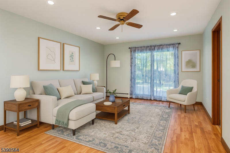 8 Cambridge Road Totowa, NJ 07512 - Photo 22 of 35 a living room with furniture and a rug