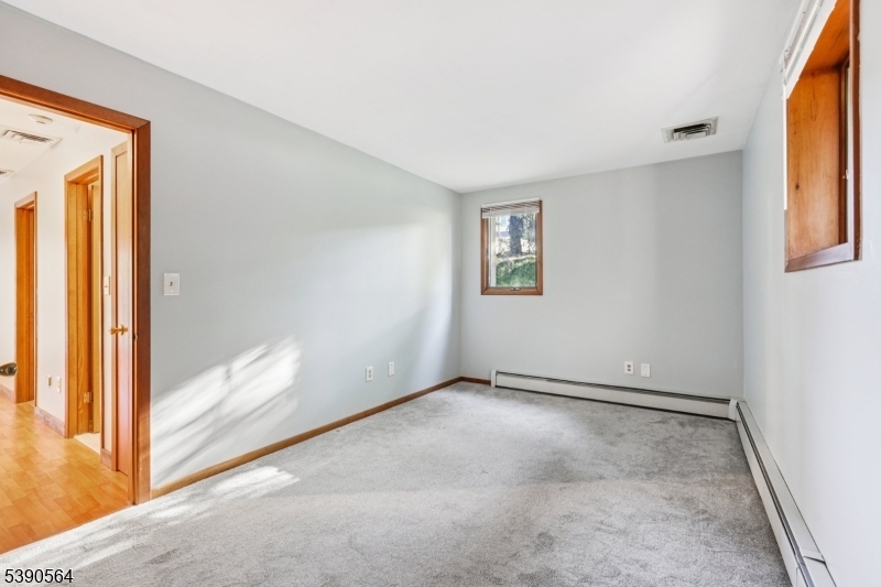 8 Cambridge Road Totowa, NJ 07512 - Photo 25 of 35 an empty room with windows