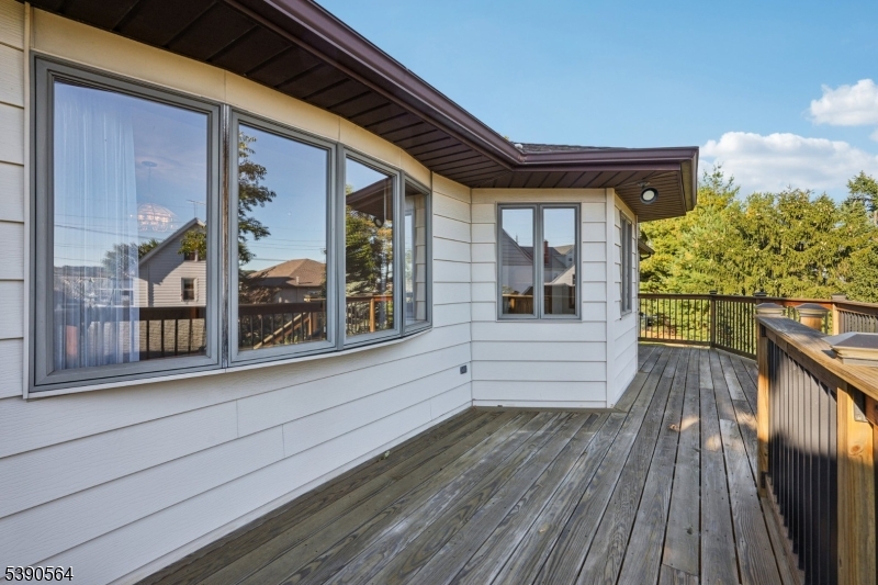 8 Cambridge Road Totowa, NJ 07512 - Photo 27 of 35 a view of a balcony with wooden floor and fence