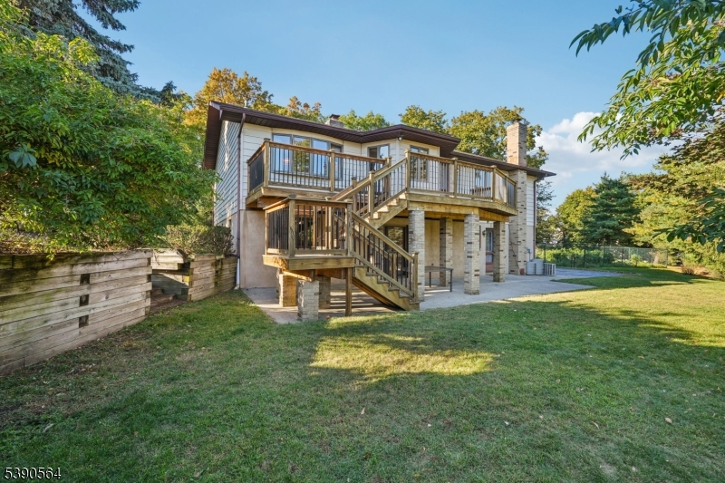 8 Cambridge Road Totowa, NJ 07512 - Photo 30 of 35 a view of a house with a yard