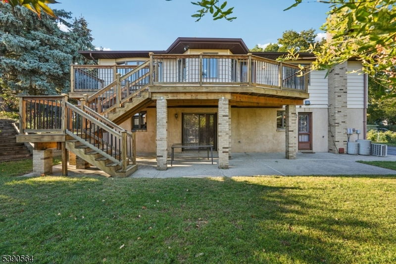8 Cambridge Road Totowa, NJ 07512 - Photo 31 of 35 a view of a house with a yard balcony