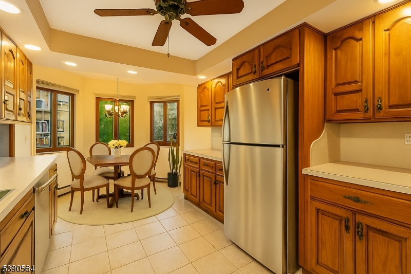 8 Cambridge Road Totowa, NJ 07512 - Photo 10 of 35 a dining hall with stainless steel appliances granite countertop furniture and a refrigerator