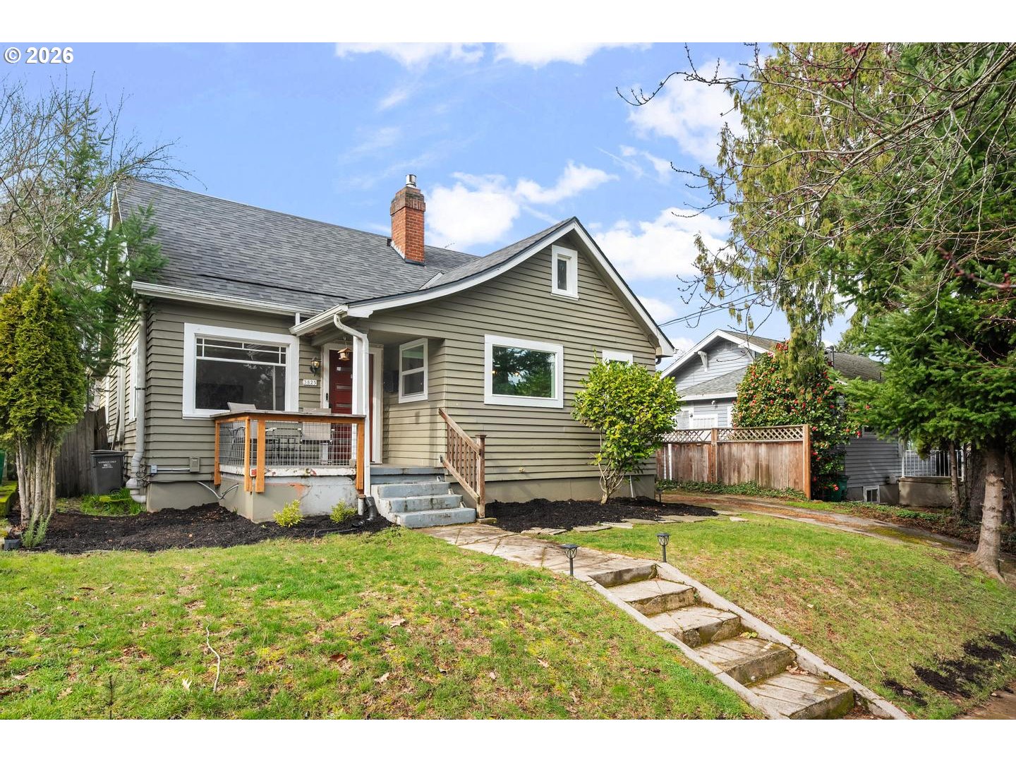 3825 Northeast 63rd Avenue Portland, OR 97213 - Photo 2 of 43 a front view of a house with a yard