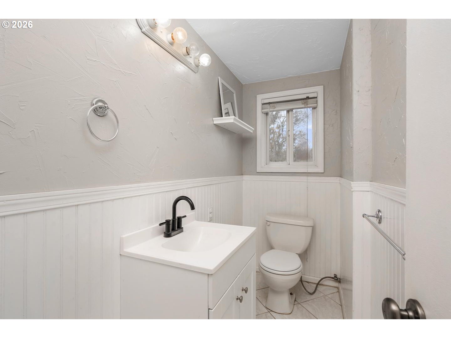 3825 Northeast 63rd Avenue Portland, OR 97213 - Photo 25 of 43 a bathroom with a toilet a sink and mirror