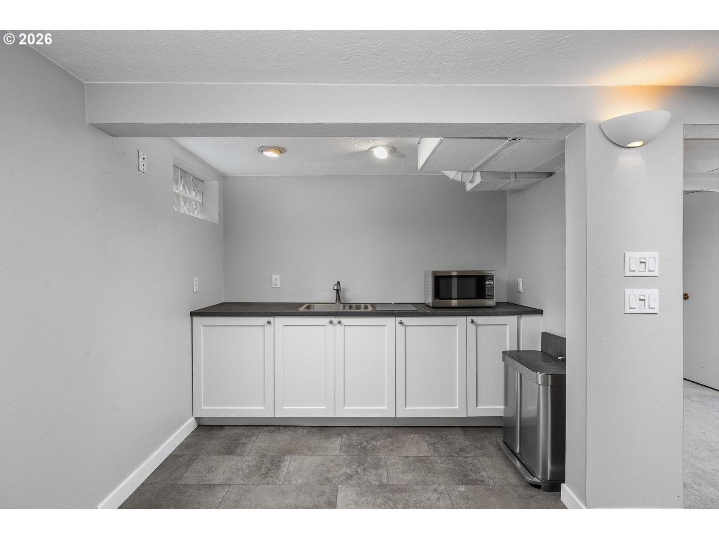 3825 Northeast 63rd Avenue Portland, OR 97213 - Photo 29 of 43 a kitchen with cabinets and a stove