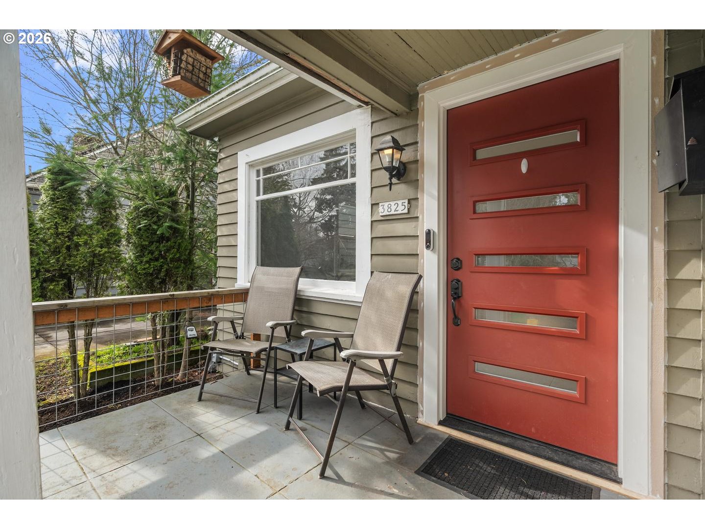 3825 Northeast 63rd Avenue Portland, OR 97213 - Photo 3 of 43 a balcony with table and chairs