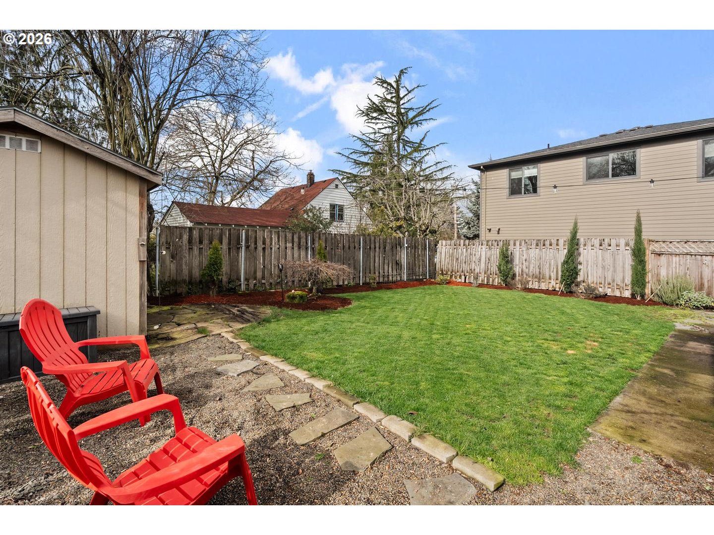 3825 Northeast 63rd Avenue Portland, OR 97213 - Photo 39 of 43 a backyard of a house with table and chairs