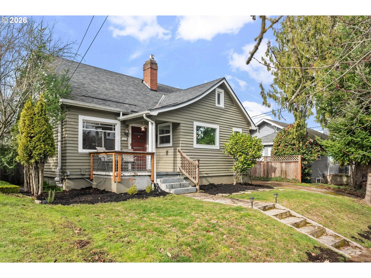 3825 Northeast 63rd Avenue Portland, OR 97213 - Photo 4 of 43 a front view of a house with a yard