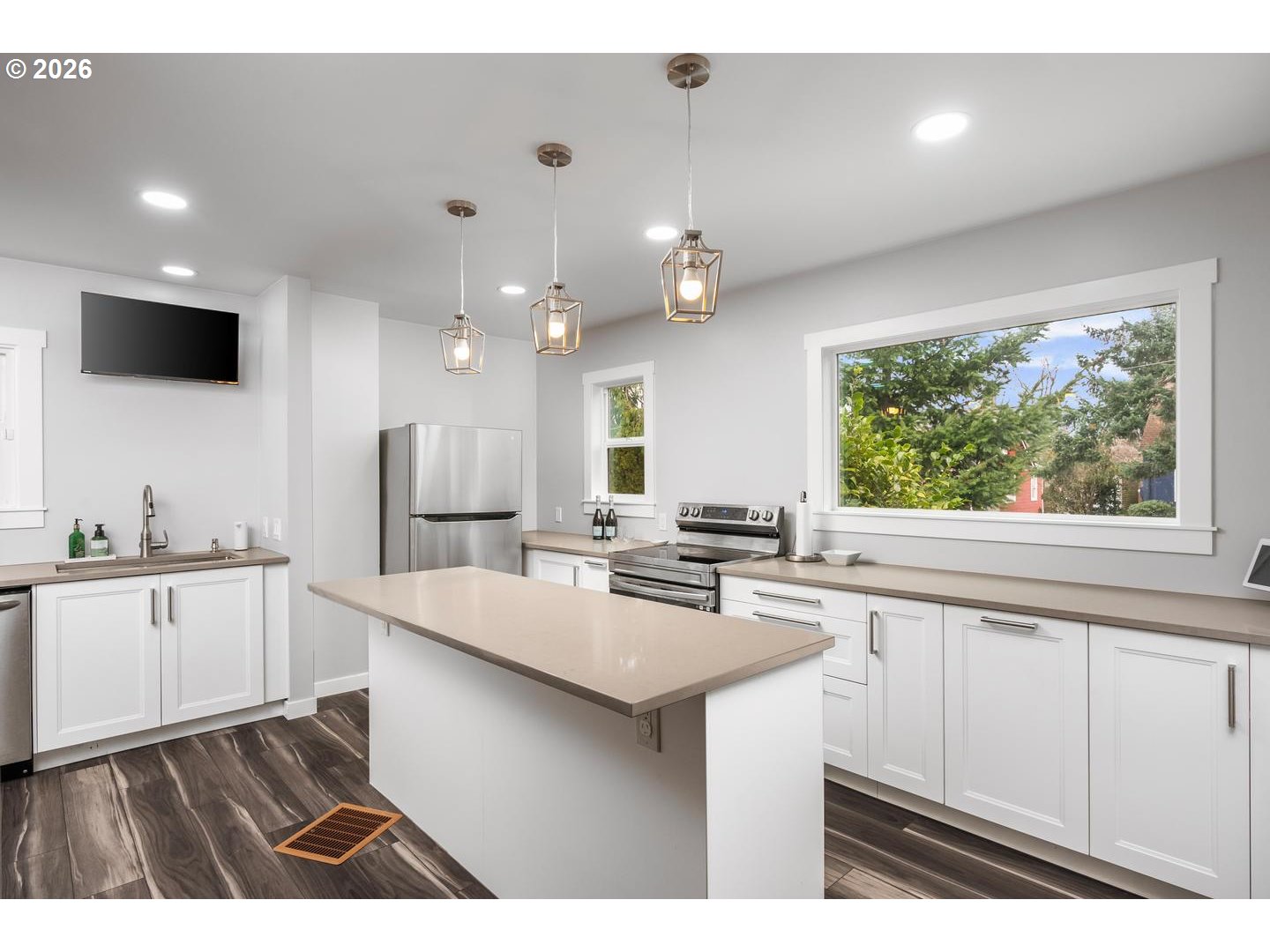 3825 Northeast 63rd Avenue Portland, OR 97213 - Photo 5 of 43 a kitchen with counter top space sink and center island