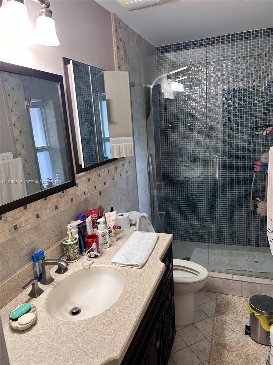 2600 Southwest 126th Avenue Miami, FL 33175 - Photo 15 of 23 a bathroom with a sink toilet and shower