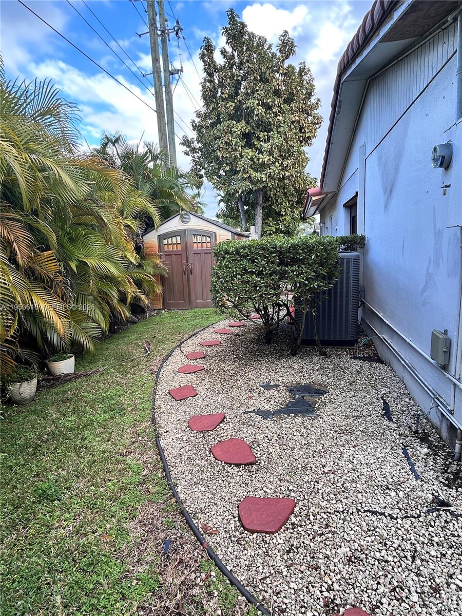 2600 Southwest 126th Avenue Miami, FL 33175 - Photo 22 of 23 a view of a backyard with plants and outdoor seating