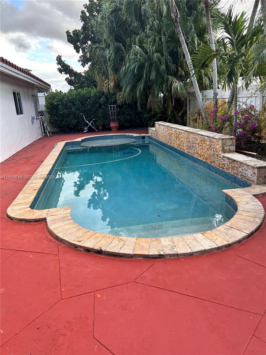 2600 Southwest 126th Avenue Miami, FL 33175 - Photo 23 of 23 a view of a swimming pool with a yard