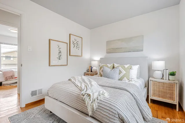 a bedroom with a bed and a couch