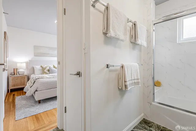 a bedroom with a bed and cabinets