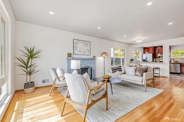 a living room with furniture and a table
