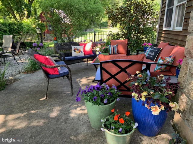 a view of a chairs and tables in the patio