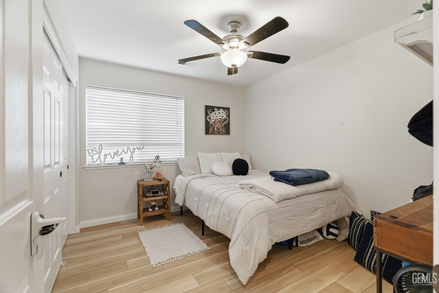 Undisclosed Address Tehachapi, CA 93561 - Photo 19 of 40 a bedroom with a bed and a large window