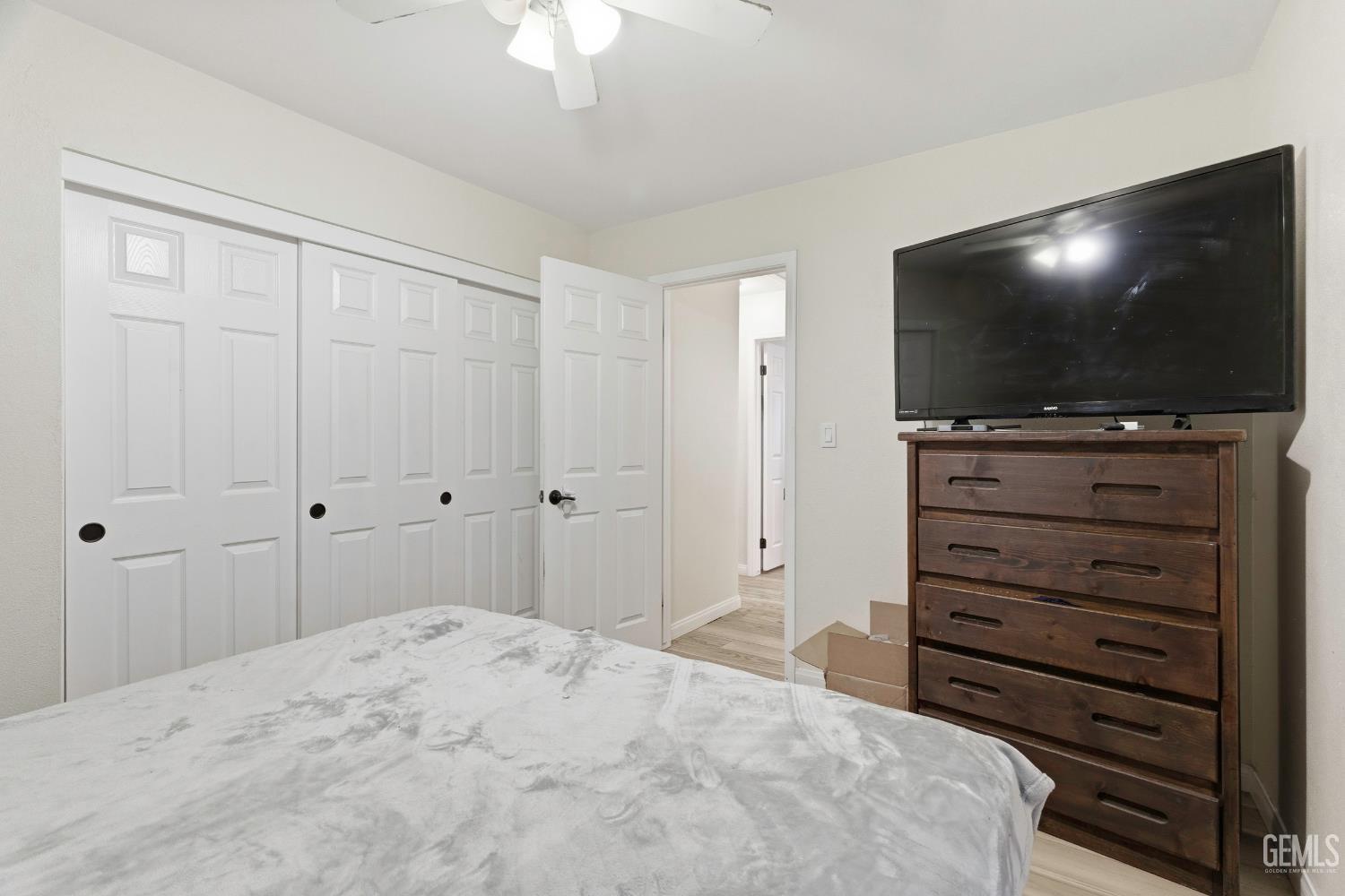 Undisclosed Address Tehachapi, CA 93561 - Photo 22 of 40 a room with a bed and a flat screen tv
