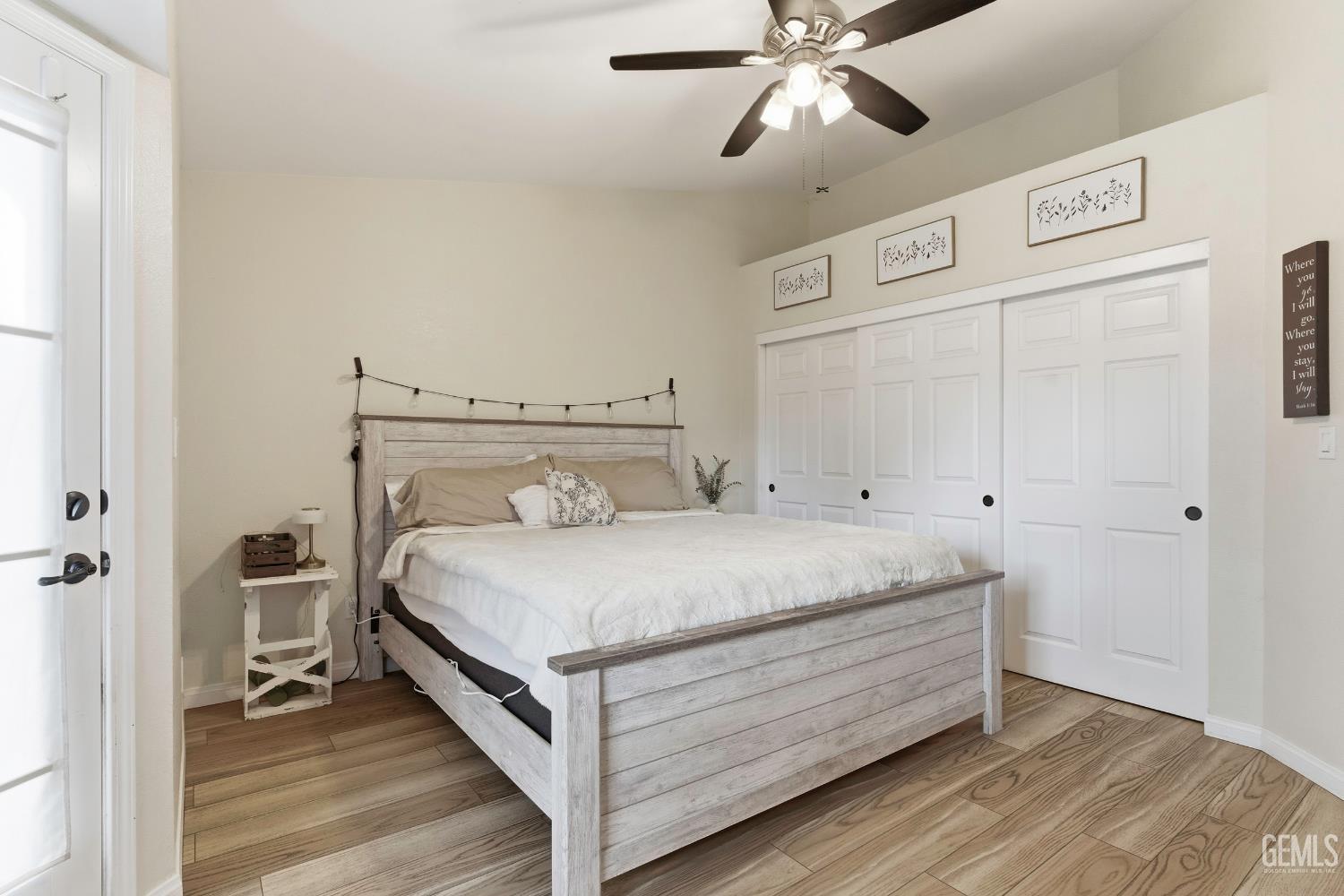 Undisclosed Address Tehachapi, CA 93561 - Photo 24 of 40 a room with a bed and a ceiling fan