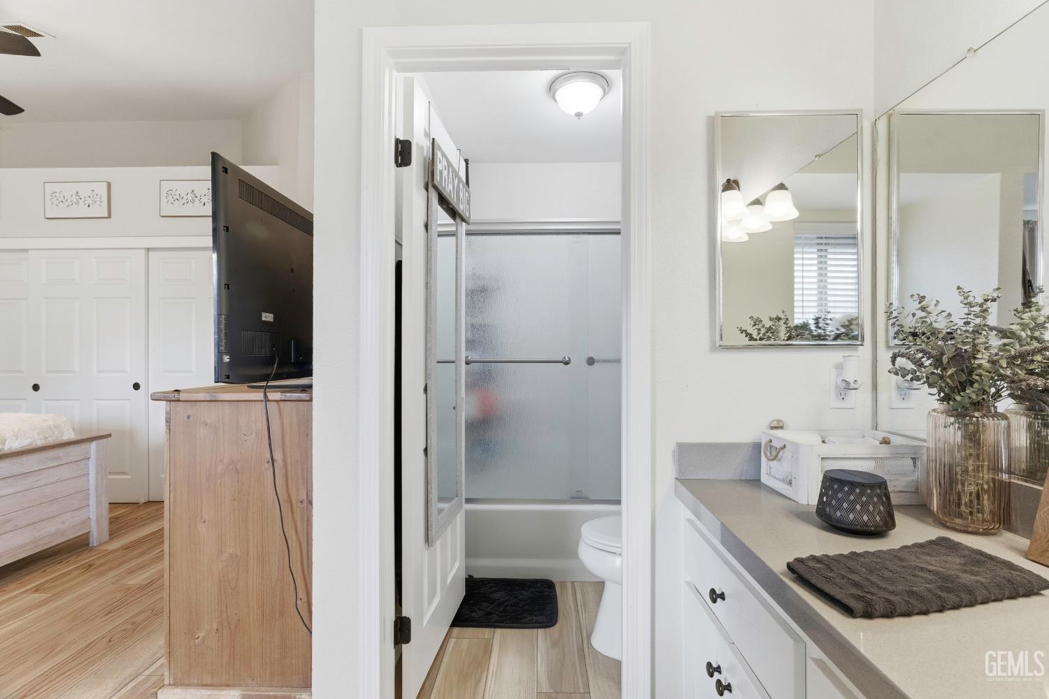 Undisclosed Address Tehachapi, CA 93561 - Photo 29 of 40 a bathroom with a granite countertop sink a toilet and shower
