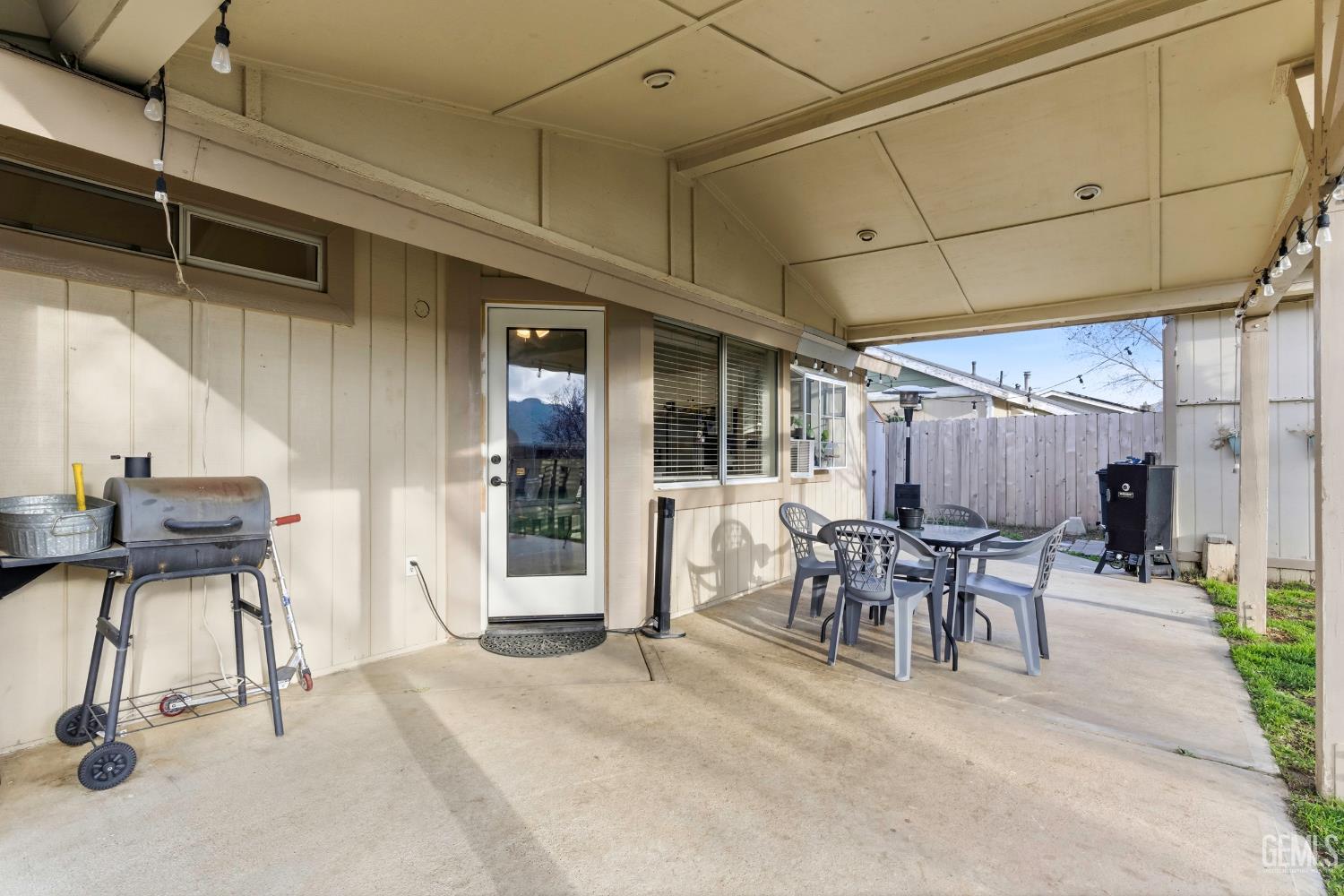 Undisclosed Address Tehachapi, CA 93561 - Photo 32 of 40 a view of a patio with table and chairs and wooden floor