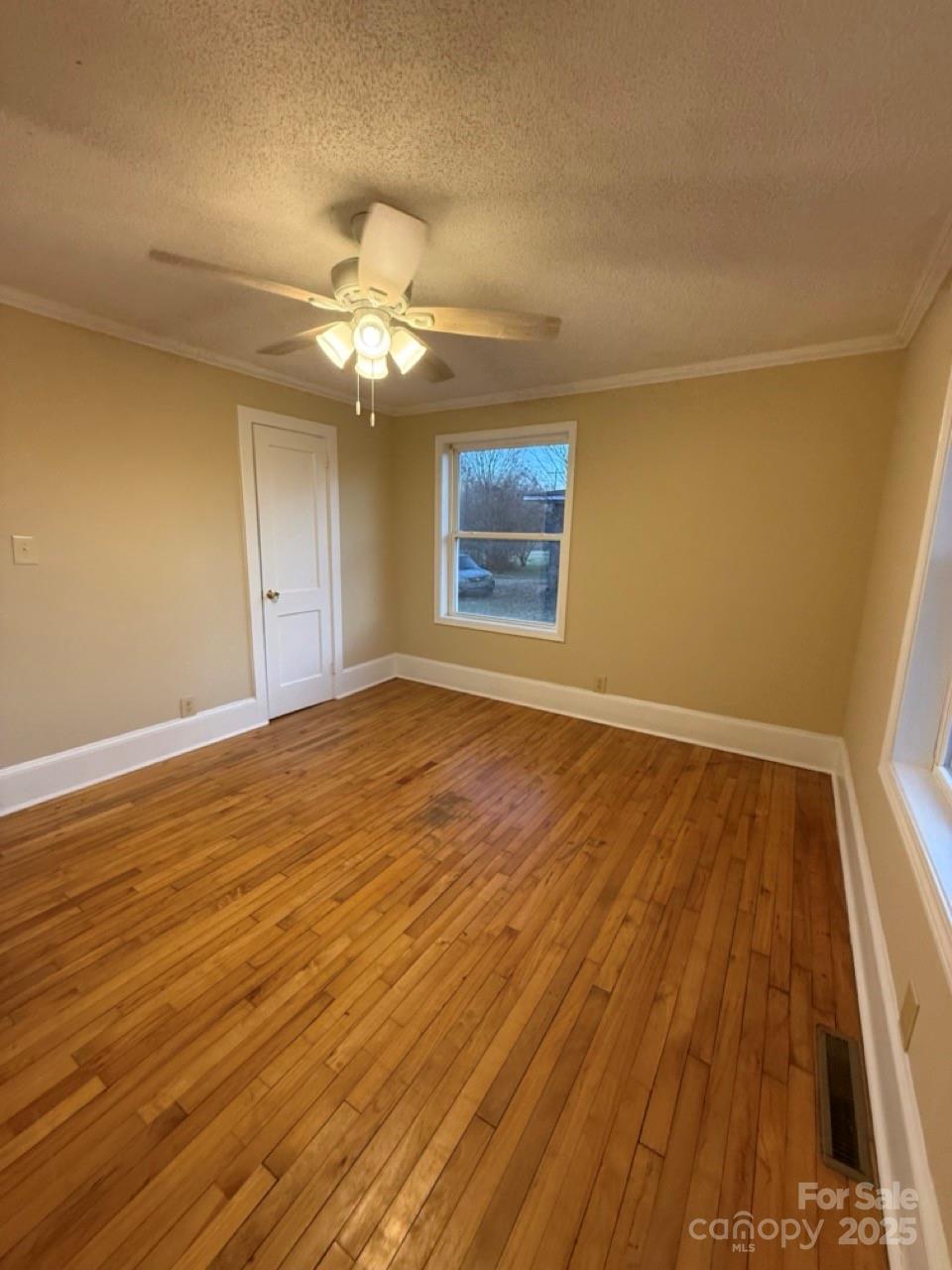 226 Shepherd Road Mooresville, NC 28115 - Photo 10 of 17 wooden floor in an empty room with a window