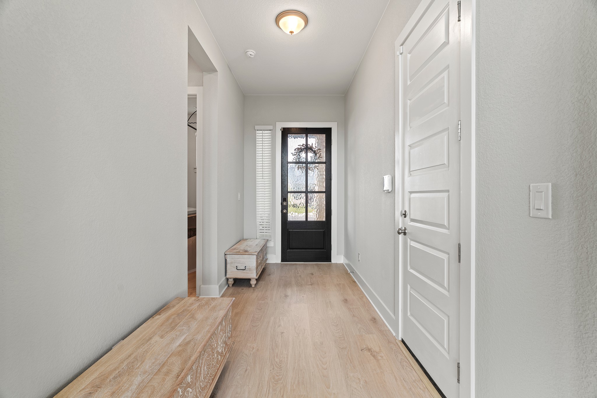 2112 Tobiano Trace Georgetown, TX 78633 - Photo 3 of 40 Doorway with wood finished floors and baseboards