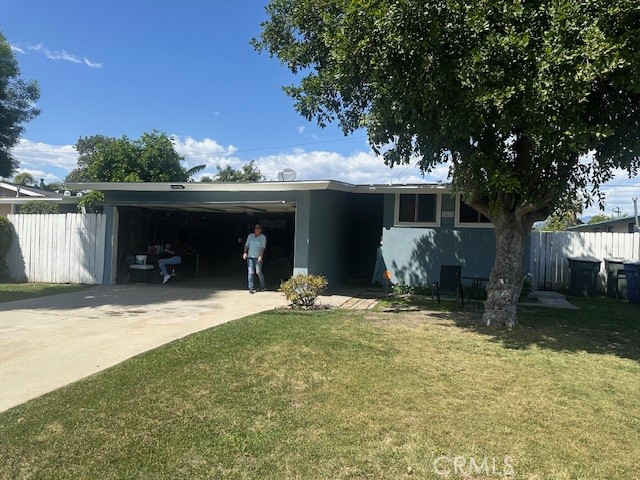a view of a house with a yard and garage