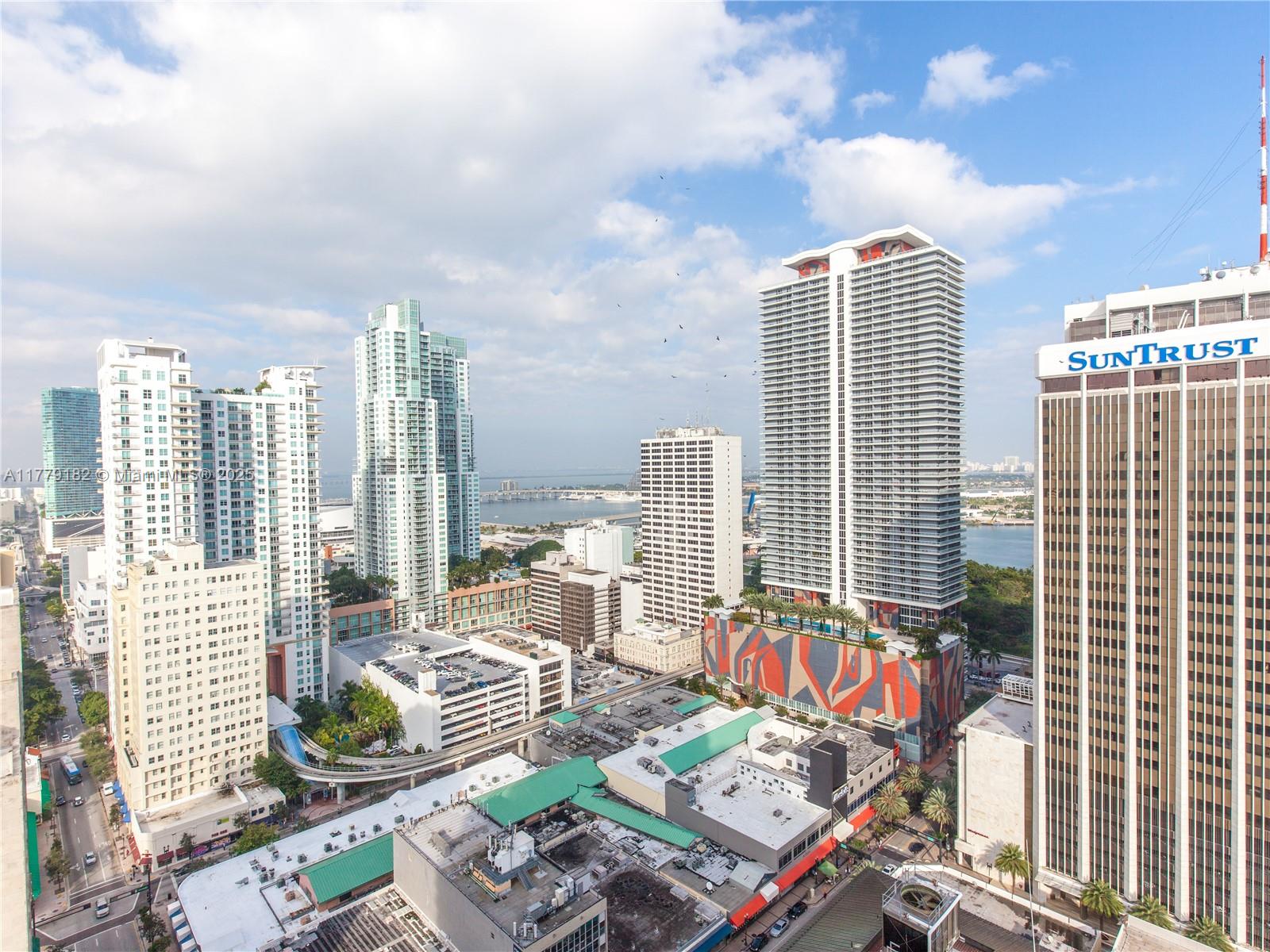 151 Southeast 1st Street, Unit 2802 Miami, FL 33131 - Photo 13 of 19 a view of balcony with couch and outdoor space