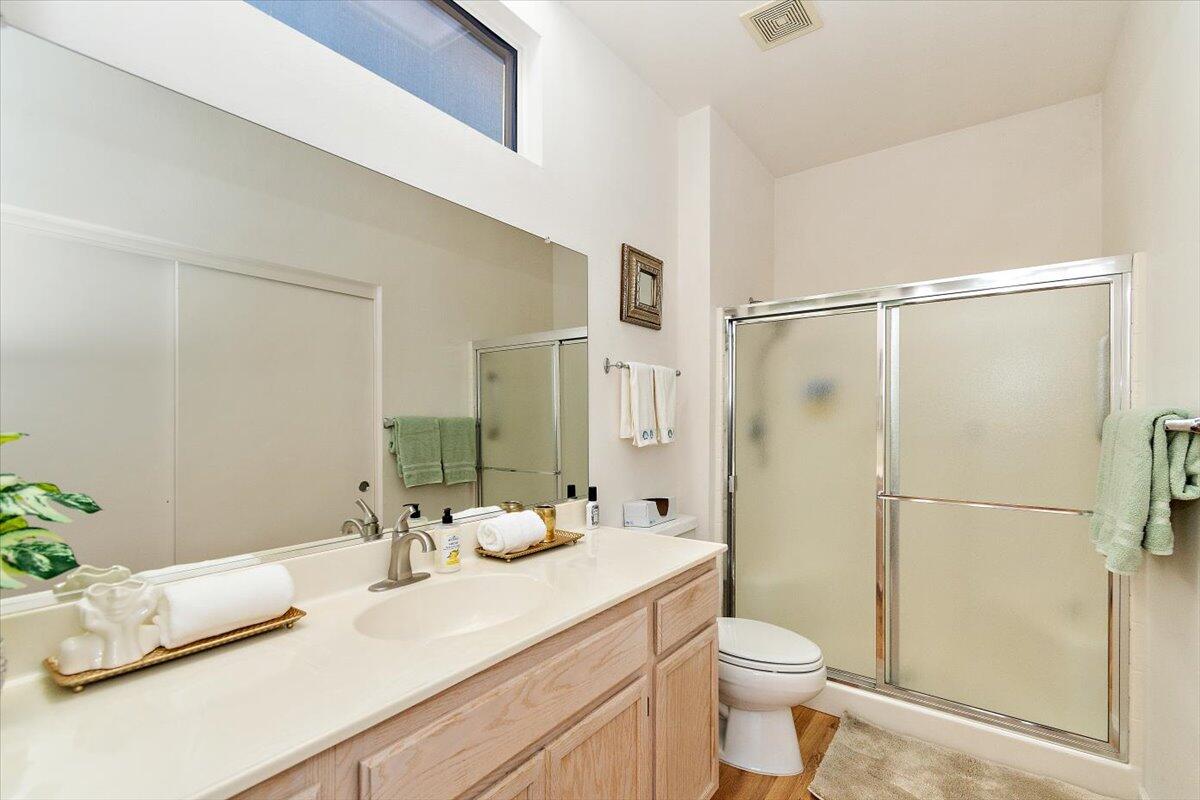 78995 Champagne Lane Palm Desert, CA 92211 - Photo 18 of 26 a bathroom with a granite countertop sink toilet and shower