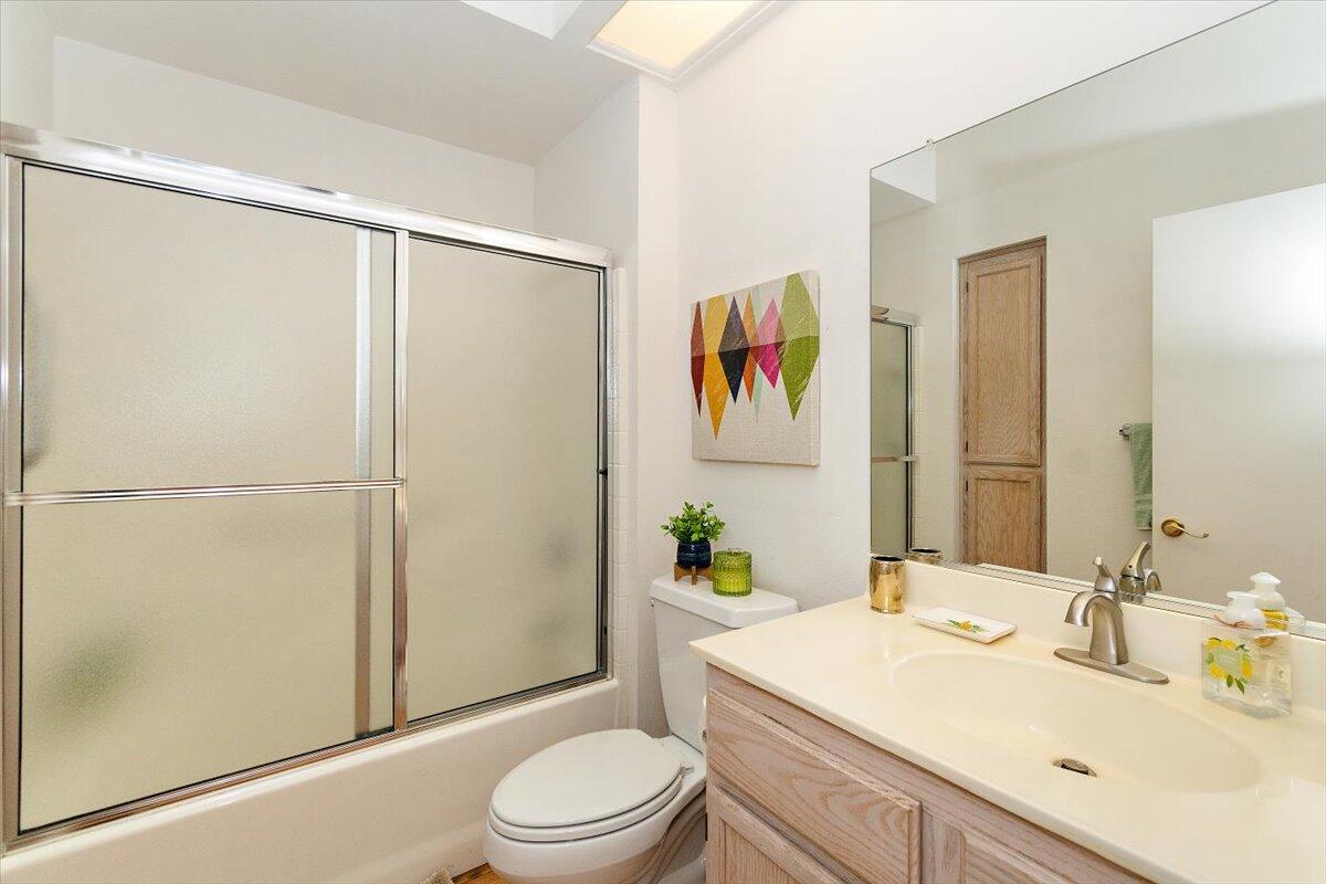 78995 Champagne Lane Palm Desert, CA 92211 - Photo 21 of 26 a bathroom with a sink a toilet and shower