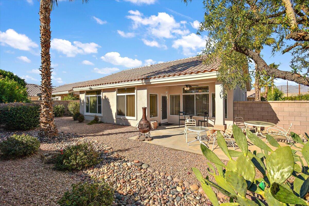 78995 Champagne Lane Palm Desert, CA 92211 - Photo 23 of 26 a house view with a sitting space and garden space