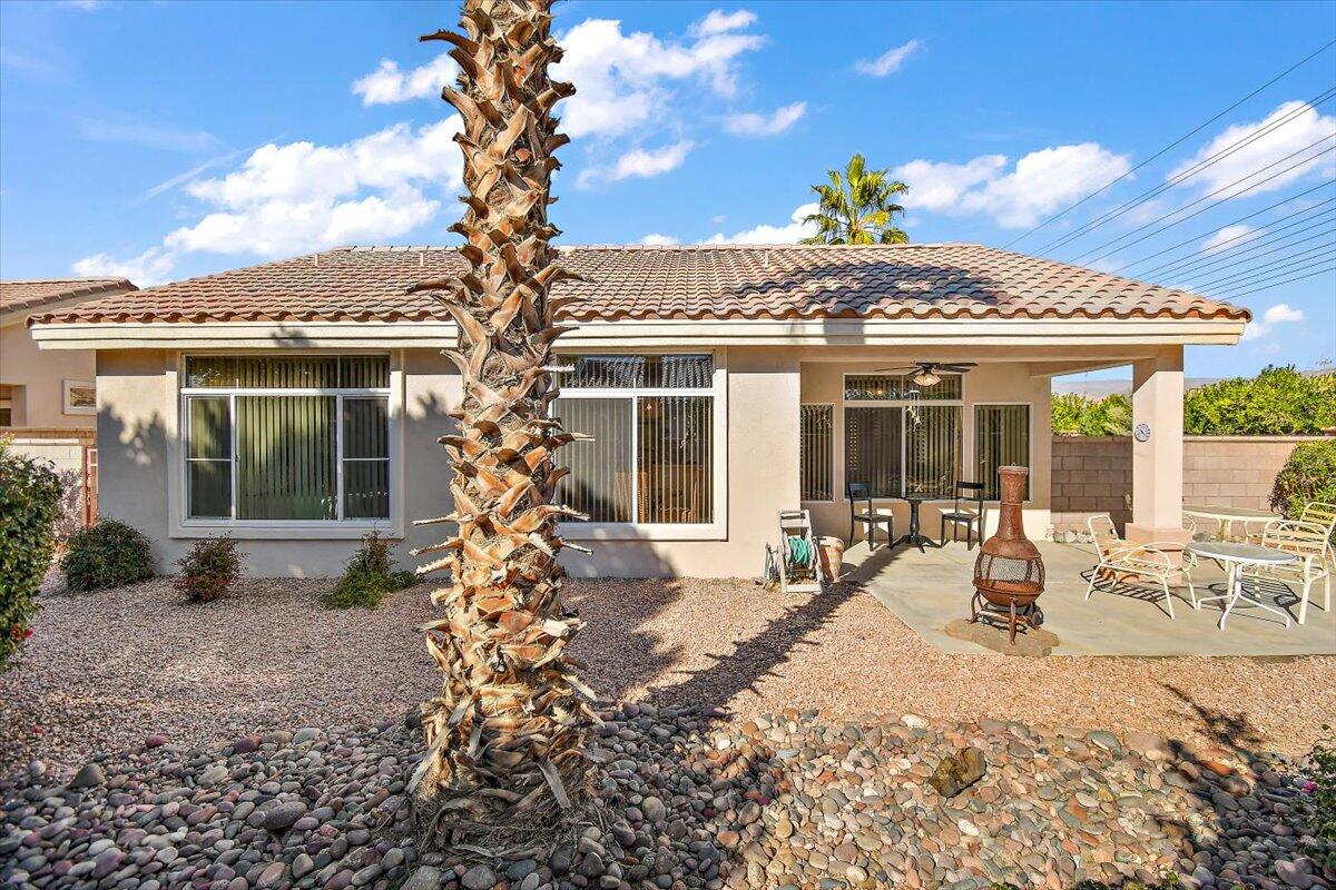78995 Champagne Lane Palm Desert, CA 92211 - Photo 24 of 26 a house view with a sitting space and garden space